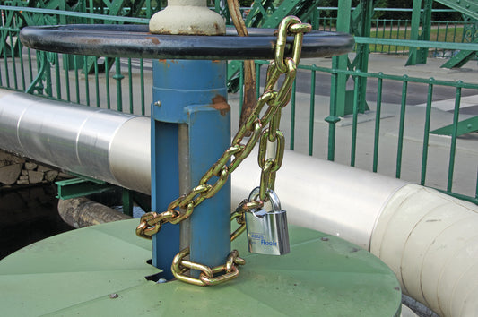 Abus Rock Padlock attached to heavy duty chain securing an industrial pipe shut