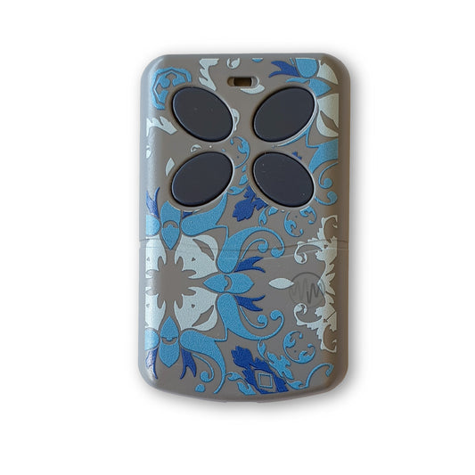 Artmatic universal garage & gate remote with blue raised flower print on front & 4 grey oval slanted buttons