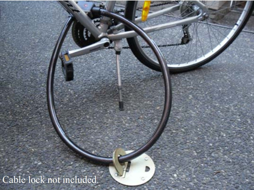 Alarm Cable lock & Anka-Loop floor anchor from Xtratec holding a bicycle in place