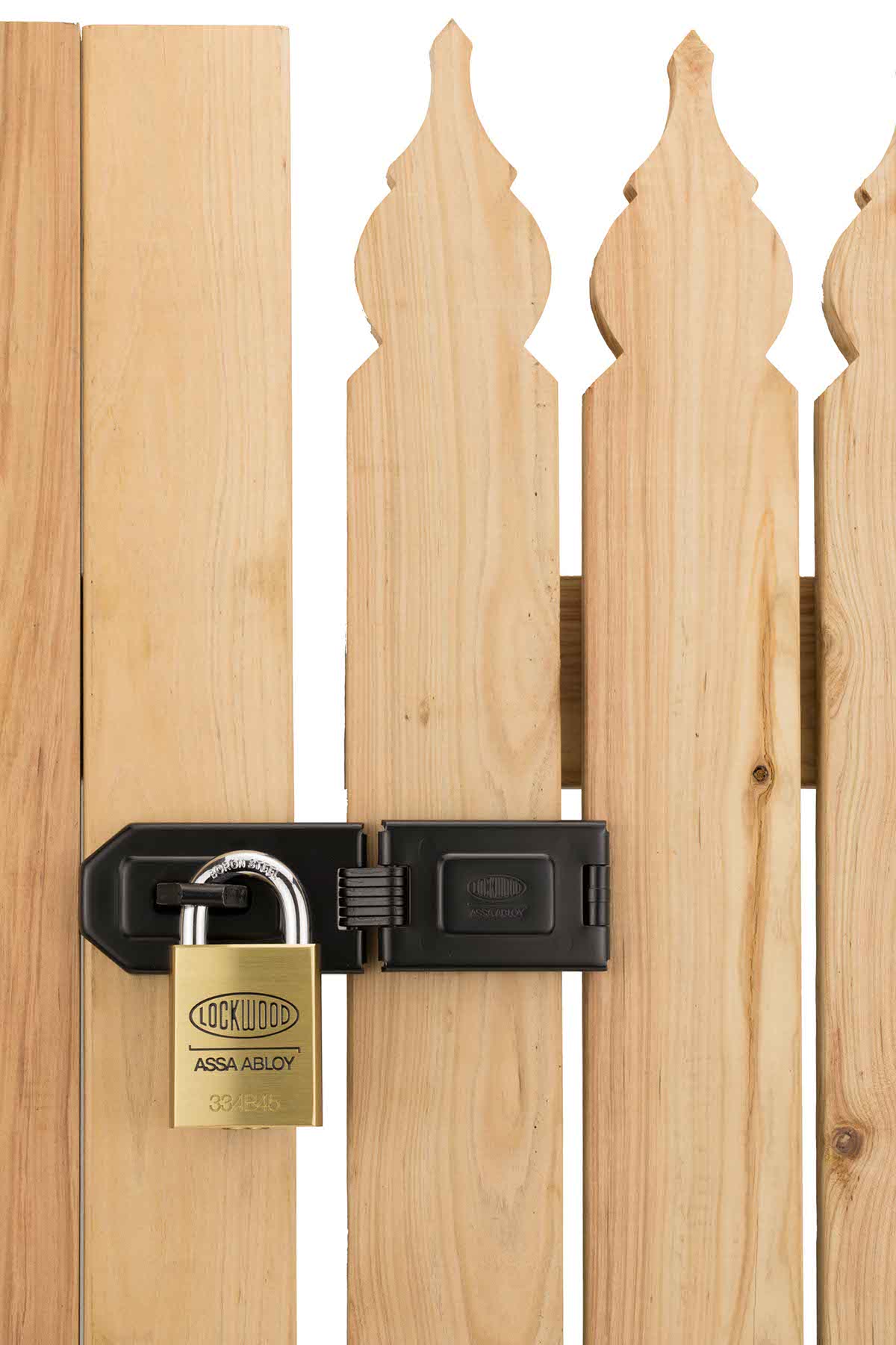 Lockwood brass padlock attached through wooden gate