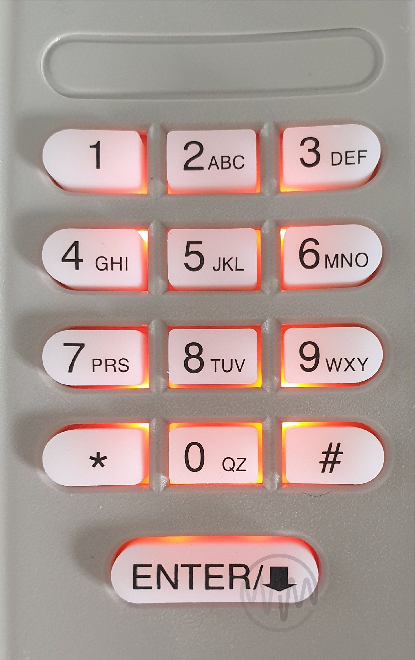 Close up of Merlin C840 garage door & gate keypad with red/orange backlight behind buttons