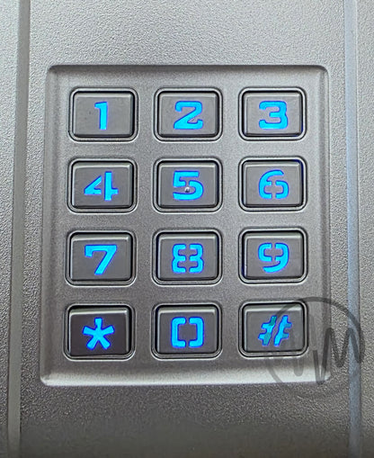 Close up View of Silver Merlin brand garage door keypad with blue backlit digits