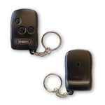 Black Uniden car alarm remote with 3 black round roman numeral marked buttons front & back view