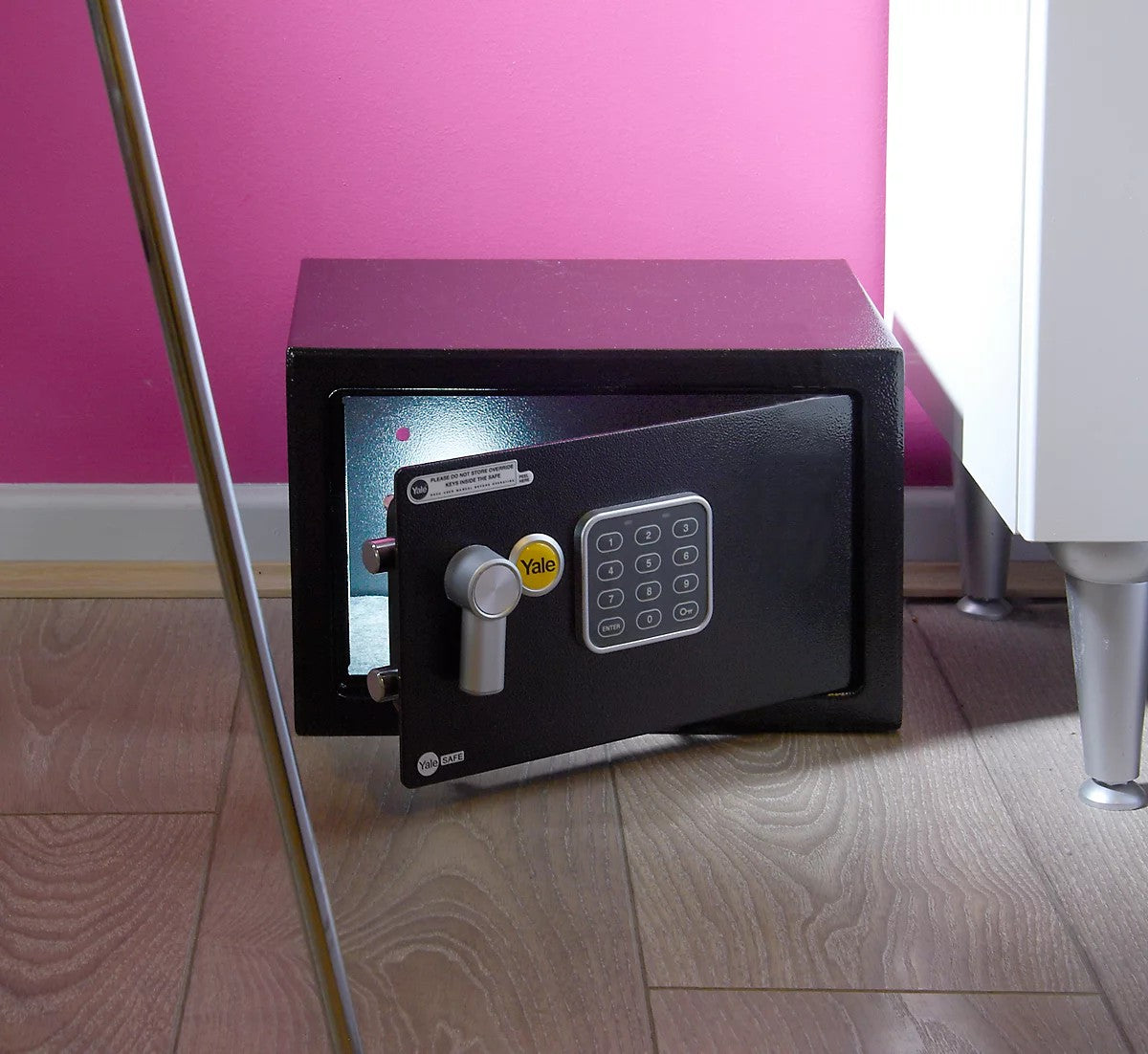Yale black medium safe open on floor