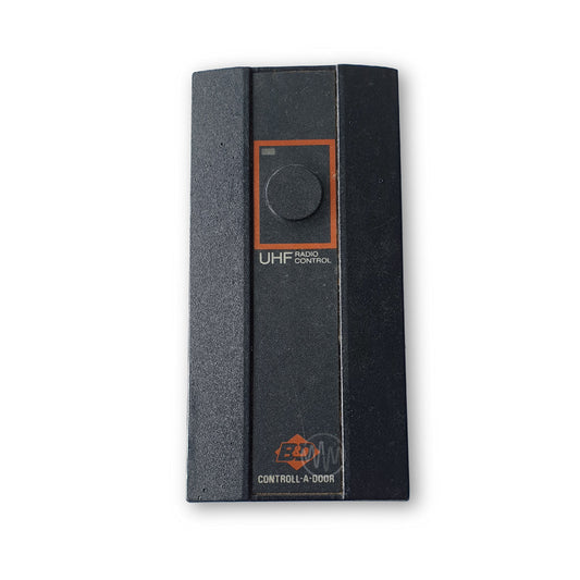 B&D Controll-A-Door large black garage door remote with 1 black round button & red box around it 