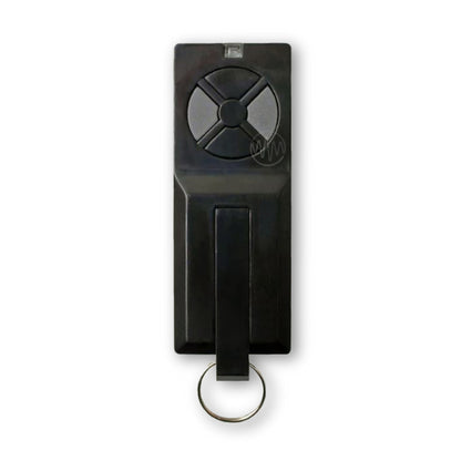 Long thin black Homentry garage door remote with circle divided in 4 halves button pad
