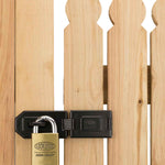 Lockwood brass padlock attached through wooden gate